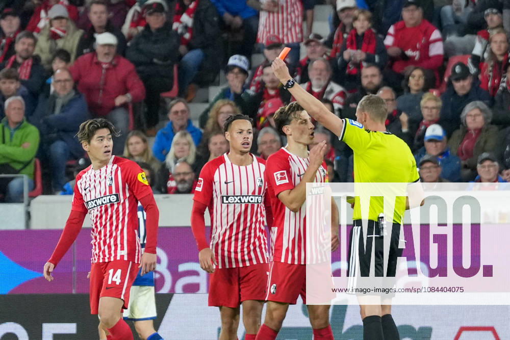 Referee Martin Petersen shows Yuito Suzuki of SC Freiburg, No. 14, a yellow-red card; Germany, soccer, Bundesliga 1, Matchday 5, 2026–2027, SC Freiburg vs. FC Schalke 04, October 11, 2026, Europa-Park Stadium, Freiburg, Baden-Württemberg, Germany