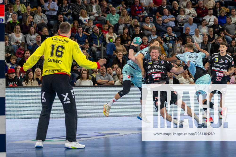Maciej Gebala (HC Erlangen), No. 77, in a one-on-one battle while shooting at Nebojsa Simic (MT Melsungen), No. 16, GER, HC Erlangen vs. MT Melsungen, Handball, Opel Handball Bundesliga, Matchday 8, 2026–2027 season, October 11, 2026 GER, HC Erlangen vs. MT Melsungen, Handball, Opel Handball Bundesliga, Matchday 8, 2026–2027 season, October 11, 2026 Nuremberg