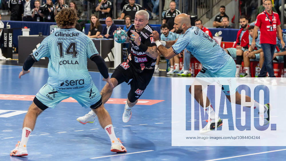 Marek Nissen, HC Erlangen, 06, in a one-on-one with Adrian Sipos, MT Melsungen, 08, Johannes Golla, MT Melsungen, 14, GER, HC Erlangen vs. MT Melsungen, Handball, Opel Handball Bundesliga, Matchday 8, 2026–2027 season, October 11, 2026 GER, HC Erlangen vs. MT Melsungen, Handball, Opel Handball Bundesliga, Matchday 8, 2026–2027 season, October 11, 2026 Nuremberg