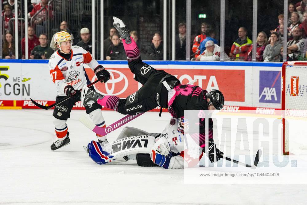 Ice Hockey: Penny DEL, Matchday 8—Cologne Sharks vs. Nuremberg Ice Tigers on October 11, 2026, at the Lanxess Arena in Cologne. Patrick Russell (Cologne), center, collides with Nuremberg goalie Niklas Treutle. According to the regulations of the DEL (German Ice Hockey League), the publication and further use of the footage in electronic media and on devices of any kind during the game is not permitted.