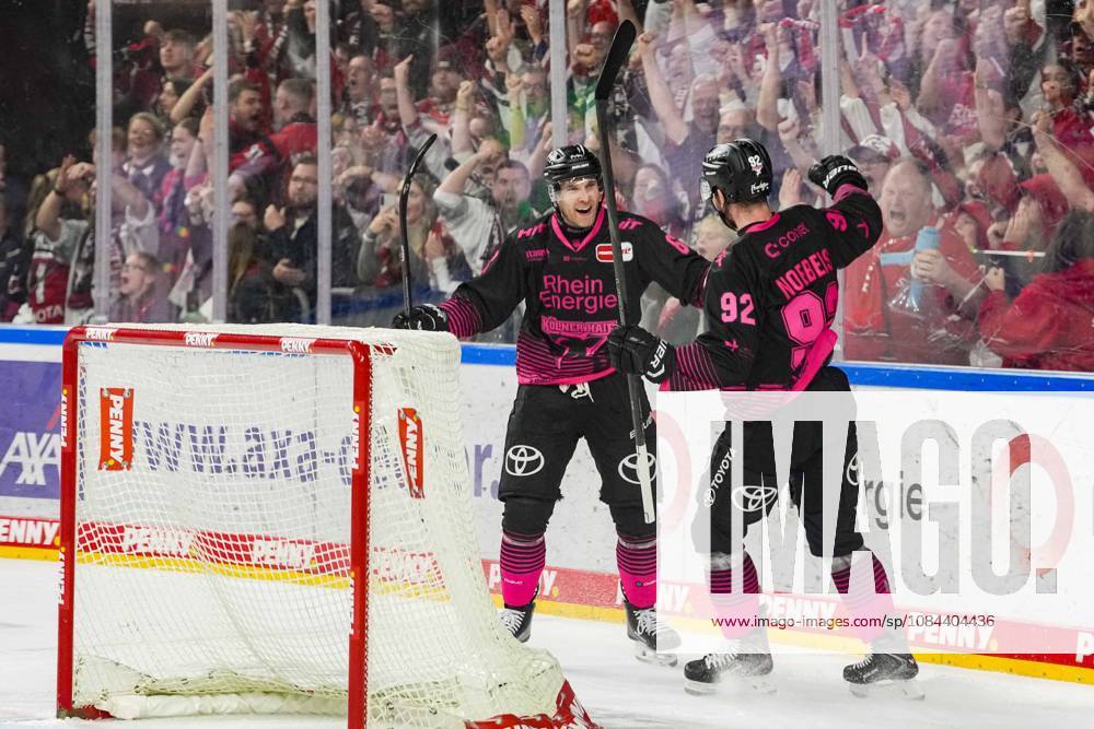 Ice Hockey: Penny DEL, Matchday 8—Cologne Sharks vs. Nuremberg Ice Tigers on October 11, 2026, at the Lanxess Arena in Cologne. Patrick Russell (Cologne), on the left, and Marcel Noebels (Cologne), on the right, celebrate the empty-net goal that sealed the 4–2 victory. In accordance with the regulations of the DEL (German Ice Hockey League), the publication and further use of the footage in electronic media and on devices of any kind during the game is not permitted.