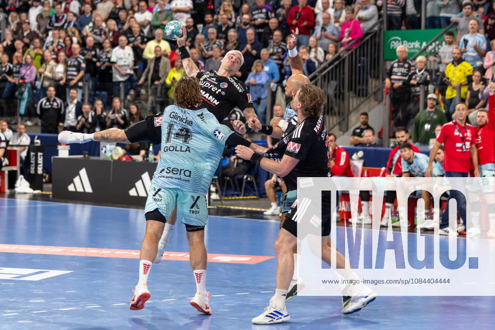 Marek Nissen (HC Erlangen), No. 06, in mid-air as he shoots; Johannes Golla (MT Melsungen), No. 14; GER; HC Erlangen vs. MT Melsungen; Handball; Opel Handball Bundesliga; Matchday 8; 2026–2027 season; October 11, 2026, GER, HC Erlangen vs. MT Melsungen, Handball, Opel Handball Bundesliga, Matchday 8, 2026–2027 season, October 11, 2026, Nuremberg