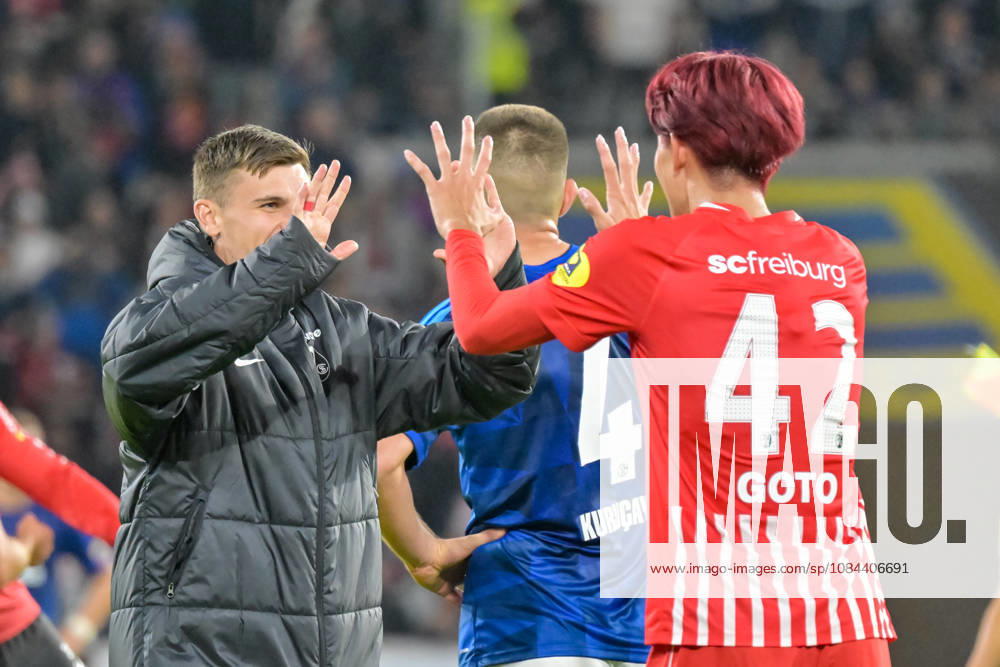 Keisuke Goto (SC Freiburg), 42, and Yannik Engelhardt (SC Freiburg), 16, celebrate. GER, SC Freiburg vs. Schalke 04, Soccer, Bundesliga, Matchday 5, 2026–2027 season, October 11, 2026 DFL and DFB regulations prohibit any use of photographs as image sequences and or quasi-video GER, SC Freiburg vs. Schalke 04, soccer, Bundesliga, Matchday 5, 2026–2027 season, October 11, 2026, Freiburg