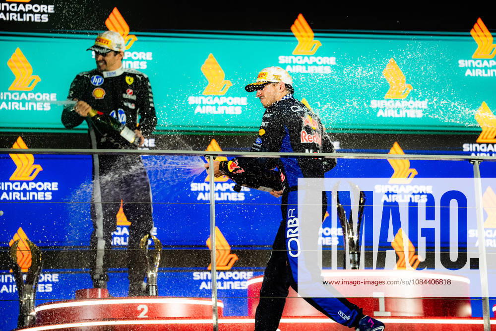 2026 Formula 1 Singapore Grand Prix - Podium CHARLES LECLERC 16 (MON) of Scuderia Ferrari HP (Ferrari SF-26) and MAX VERSTAPPEN 1 (NED) of Oracle Red Bull Racing (Red Bull Racing RB22) champagne celebration on the podium on Sunday Race Day during the Formula 1 Singapore Airlines Singapore Grand Prix 2026 at Marina Bay Street Circuit, Singapore, on October 11, 2026. Photo by Antoine Lapeyre Reveries Agency via ABACAPRESS.COM Singapore Singapore