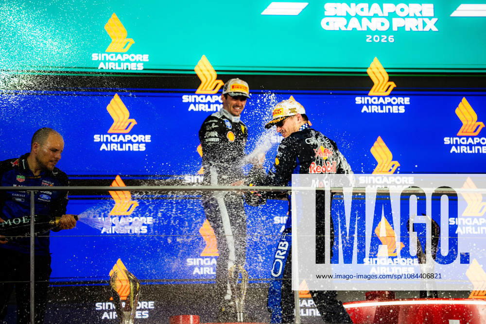 2026 Formula 1 Singapore Grand Prix - Podium CHARLES LECLERC 16 (MON) of Scuderia Ferrari HP (Ferrari SF-26) and MAX VERSTAPPEN 1 (NED) of Oracle Red Bull Racing (Red Bull Racing RB22) champagne celebration on the podium on Sunday Race Day during the Formula 1 Singapore Airlines Singapore Grand Prix 2026 at Marina Bay Street Circuit, Singapore, on October 11, 2026. Photo by Antoine Lapeyre Reveries Agency via ABACAPRESS.COM Singapore Singapore