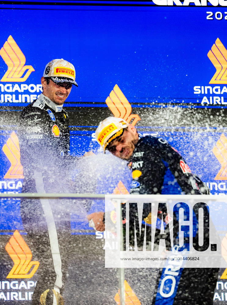 2026 Formula 1 Singapore Grand Prix - Podium CHARLES LECLERC 16 (MON) of Scuderia Ferrari HP (Ferrari SF-26) and MAX VERSTAPPEN 1 (NED) of Oracle Red Bull Racing (Red Bull Racing RB22) champagne celebration on the podium on Sunday Race Day during the Formula 1 Singapore Airlines Singapore Grand Prix 2026 at Marina Bay Street Circuit, Singapore, on October 11, 2026. Photo by Antoine Lapeyre Reveries Agency via ABACAPRESS.COM Singapore Singapore