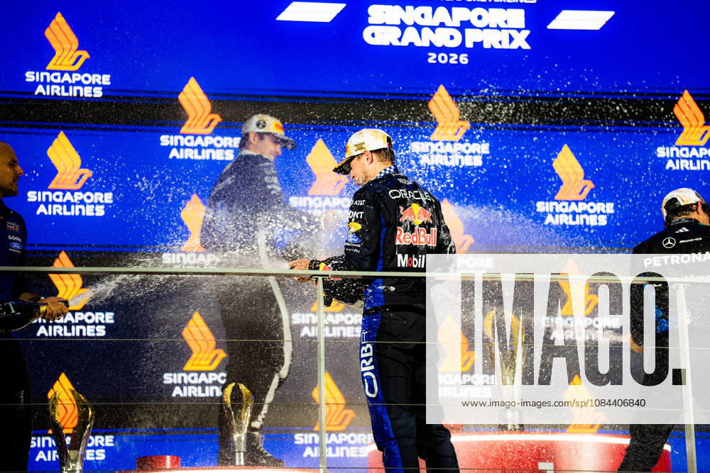 2026 Formula 1 Singapore Grand Prix - Podium CHARLES LECLERC 16 (MON) of Scuderia Ferrari HP (Ferrari SF-26) and MAX VERSTAPPEN 1 (NED) of Oracle Red Bull Racing (Red Bull Racing RB22) champagne celebration on the podium on Sunday Race Day during the Formula 1 Singapore Airlines Singapore Grand Prix 2026 at Marina Bay Street Circuit, Singapore, on October 11, 2026. Photo by Antoine Lapeyre Reveries Agency via ABACAPRESS.COM Singapore Singapore