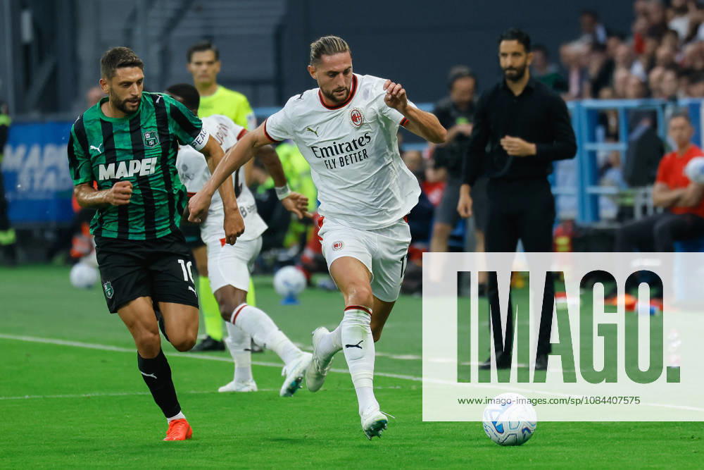 IPA89560269 - Milan s Adrien Rabiot and Sassuolo s Domenico Berardi during the US Sassuolo vs. AC Milan Italian Serie A soccer match in Reggio Emilia, Italy, on October 11, 2026