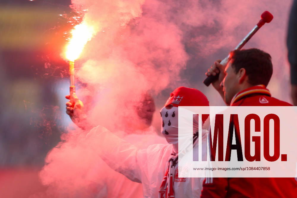 Soccer, Bundesliga, 1. FC Köln vs. Borussia Mönchengladbach, RheinEnergieSTADION, Matchday 5, 2026–2027 season. A masked Cologne fan holding a flares. DFB regulations prohibit the use of photographs as image sequences and or quasi-video. Photo: WilkowskixPressefotoKochx, North Rhine-Westphalia, Germany