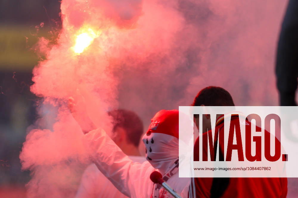 Soccer, Bundesliga, 1. FC Köln vs. Borussia Mönchengladbach, RheinEnergieSTADION, Matchday 5, 2026–2027 season. A masked Cologne fan holding a flares. DFB regulations prohibit the use of photographs as image sequences and or quasi-video. Photo: WilkowskixPressefotoKochx, North Rhine-Westphalia, Germany