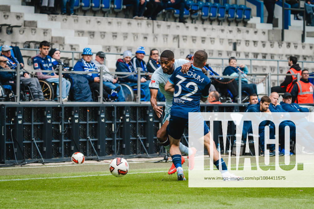 Bochum, Germany October 11, 2026 2. Bundesliga 2026–2027 Matchday 7 VfL Bochum 1848 vs. DSC Arminia Bielefeld Pictured, from left, in a tackle: Isaiah Young (DSC) and Maximilian Wittek (BOC). DFL and DFB regulations prohibit any use of photographs as image sequences and or quasi-video Vonovia Ruhrstadion, North Rhine-Westphalia