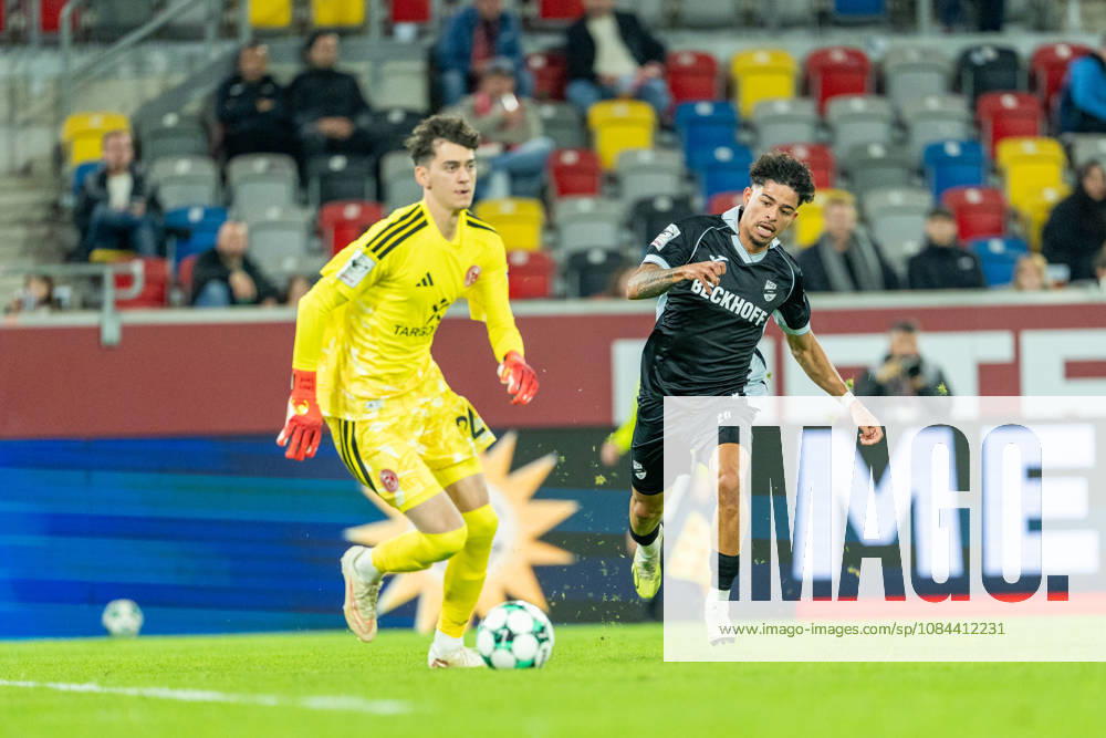 Louis Lord of Fortuna Düsseldorf, No. 22, with the ball, is tackled by Andre Leipold of SC Verl, No. 20; Fortuna Düsseldorf vs. SC Verl, soccer, 3rd Division, Matchday 8, 2026–27 season, October 12, 2026, DFL regulations prohibit any use of photographs as image sequences and or quasi-video. Fortuna Düsseldorf vs. SC Verl, soccer, 3rd Division, Matchday 8, 2026–27 season, October 12, 2026, Düsseldorf