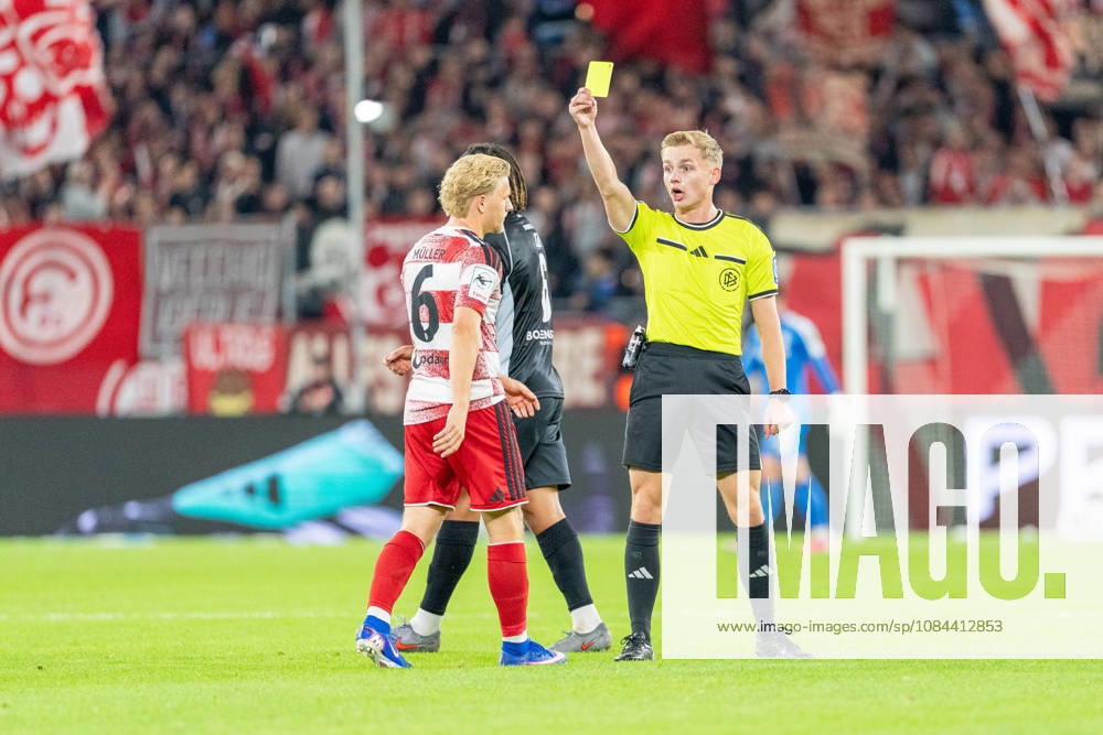 Andreas Mueller of Fortuna Düsseldorf, No. 06, receives a yellow card from referee Sebastian Hilsberg during the Fortuna Düsseldorf vs. SC Verl match, soccer, 3. Liga, Matchday 8, 2026–27 season, December 10, 2026, DFL regulations prohibit any use of photographs as image sequences and or quasi-video, Fortuna Düsseldorf vs. SC Verl, soccer, 3. Liga, Matchday 8, 2026–27 season, October 12, 2026, Düsseldorf