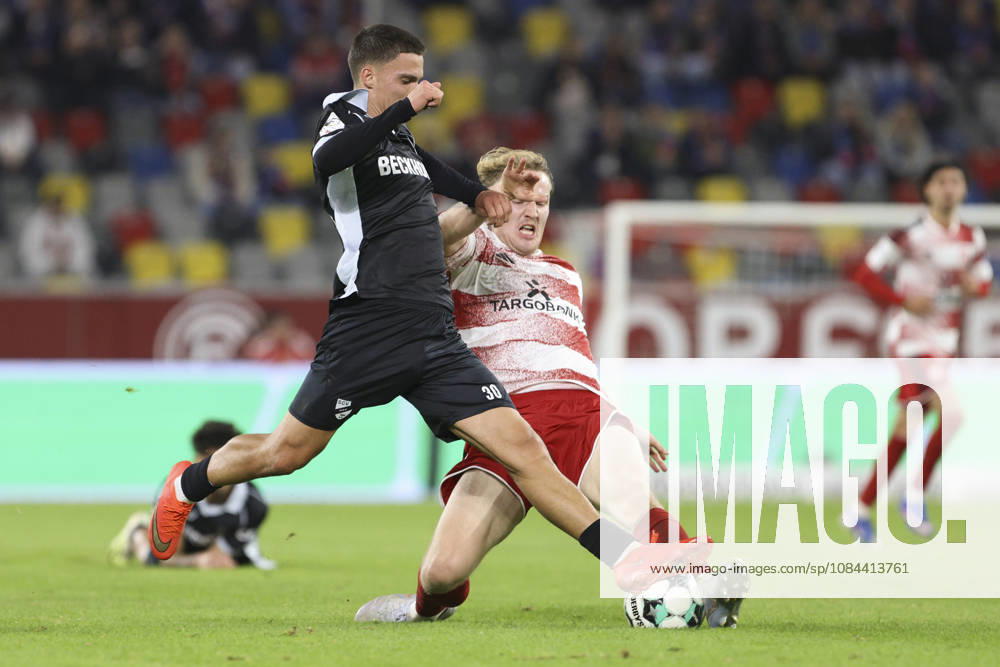 Almin Mesanovic of SC Verl and Lukas Bornschein of Fortuna Düsseldorf battle for the ball during the 3. Liga match between Fortuna Düsseldorf and SC Verl at the Merkur Spiel Arena on October 11, 2026, in Düsseldorf, Germany. Photo by Oliver Kaelke, DeFodi Images. Almin Mesanovic of SC Verl and Lukas Bornschein of Fortuna Düsseldorf battle for the ball during the 3. Liga match between Fortuna Düsseldorf and SC Verl at Merkur Spiel Arena on October 11, 2026 in Düsseldorf, Germany. Photo by Oliver Kaelke, DeFodi Images. DFB and DFL regulations prohibit any use of photographs as image sequences and or quasi-video. Photo by Oliver Kaelke, DeFodi Images.