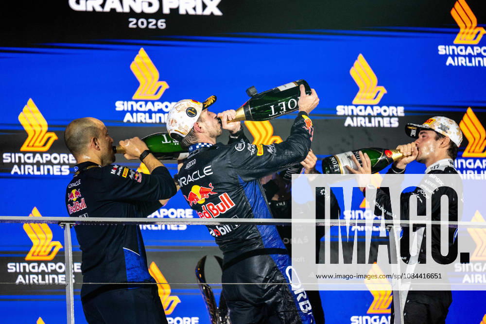 F1 - SINGAPORE GRAND PRIX 2026 LAMBIASE Gianpiero, Head of Race Engineering at Red Bull Racing, portrait, VERSTAPPEN Max (nld), Red Bull Racing Ford RB22, portrait LECLERC Charles (mco), Scuderia Ferrari SF-26, portrait Moet Chandon podium during the 2026 Formula 1 Singapore Grand Prix, 17th round of the 2026 Formula One World Championship, WM, Weltmeisterschaft from October 9 to 11, 2026 on the Marina Bay Street Circuit, in Singapore, Singapore - SingaporeSingapore