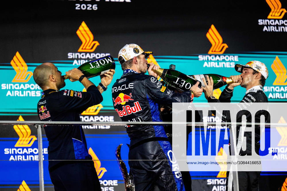 F1 - SINGAPORE GRAND PRIX 2026 LAMBIASE Gianpiero, Head of Race Engineering at Red Bull Racing, portrait, VERSTAPPEN Max (nld), Red Bull Racing Ford RB22, portrait LECLERC Charles (mco), Scuderia Ferrari SF-26, portrait Moet Chandon podium during the 2026 Formula 1 Singapore Grand Prix, 17th round of the 2026 Formula One World Championship, WM, Weltmeisterschaft from October 9 to 11, 2026 on the Marina Bay Street Circuit, in Singapore, Singapore - SingaporeSingapore