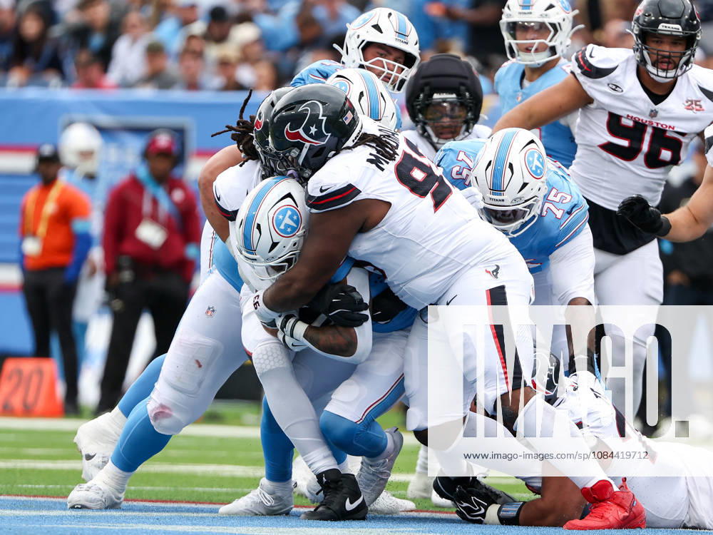Oct 11, 2026; Nashville, TN, USA; Tennessee Titans running back Tony Pollard (20) is tackled for a loss of yards during the NFL, American Football Herren, USA regular season game between the Houston Texans and Tennessee Titans at Nissan Stadium. Mandatory Credit: -Cal Media Nashville USA - ZUMAc04_ 20261011_zma_c04_072