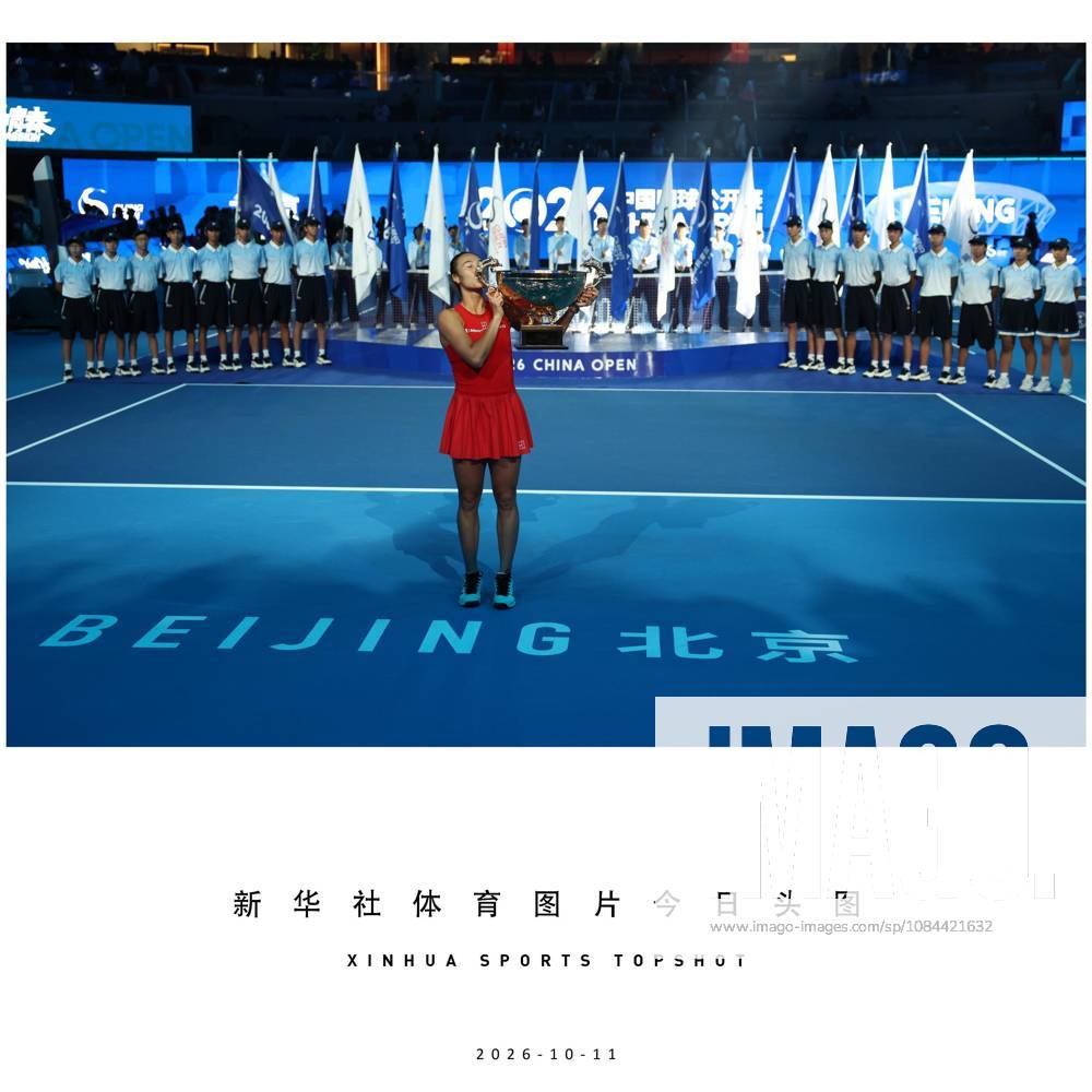 (261011) -- BEIJING, Oct. 11, 2026 -- Zheng Qinwen kisses the trophy during the awarding ceremony after the women s singles final between Zheng Qinwen of China and Mirra Andreeva of Russia at 2026 China Open tennis tournament in Beijing, China, Oct. 11, 2026. ) (SP)XINHUA SPORTS TOPSHOT ZhangxChenlin