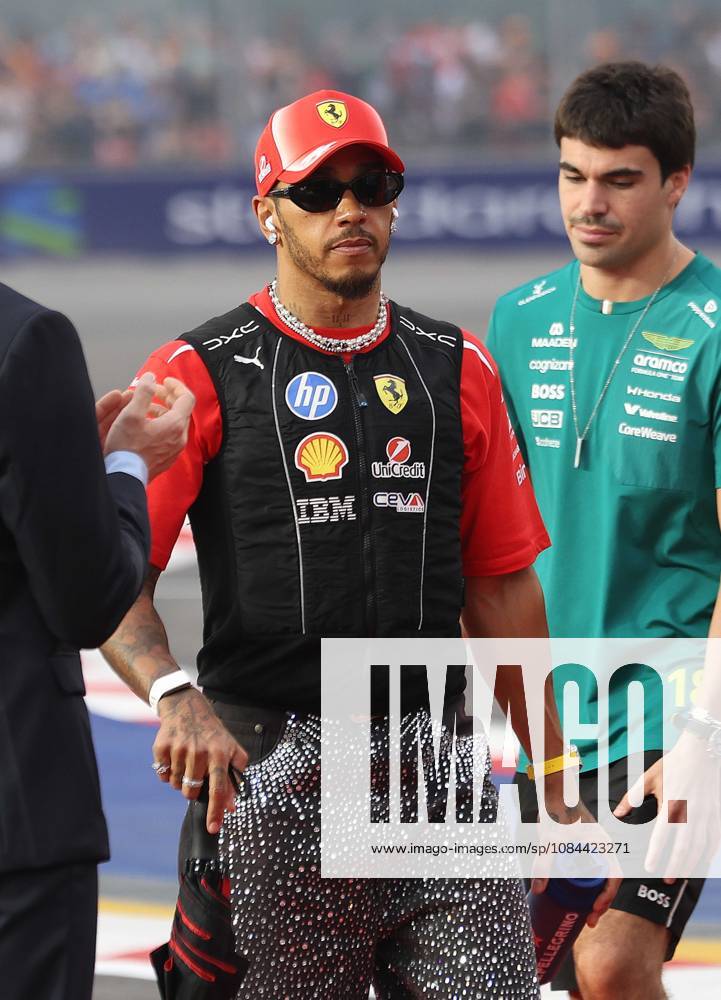 Formula 1 - Singapore Grand Prix SINGAPORE, REPUBLIC OF SINGAPORE, OCTOBER 11: Sir Lewis Hamilton racing driver for Ferrari from Great Britain during FIA Formula 1 Grand Prix of Singapore at Marina Bay Street Circuit, Singapore, Republic of Singapore on October 11. (Photo by Crystal Pix) Singapore Marina Bay Street Circuit Singapore