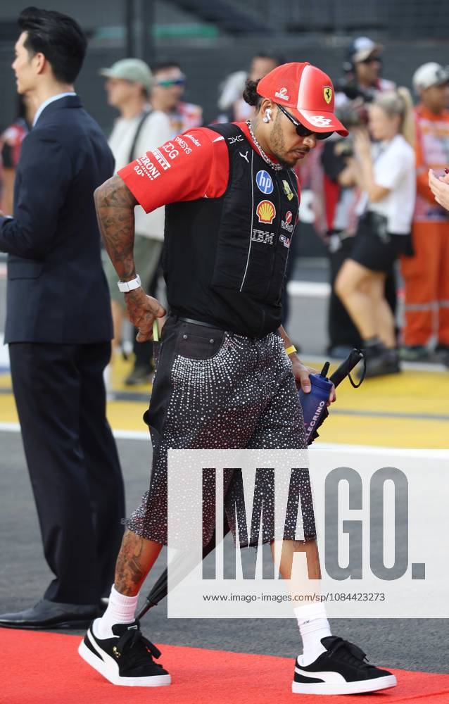 Formula 1 - Singapore Grand Prix SINGAPORE, REPUBLIC OF SINGAPORE, OCTOBER 11: Sir Lewis Hamilton racing driver for Ferrari from Great Britain during FIA Formula 1 Grand Prix of Singapore at Marina Bay Street Circuit, Singapore, Republic of Singapore on October 11. (Photo by Crystal Pix) Singapore Marina Bay Street Circuit Singapore