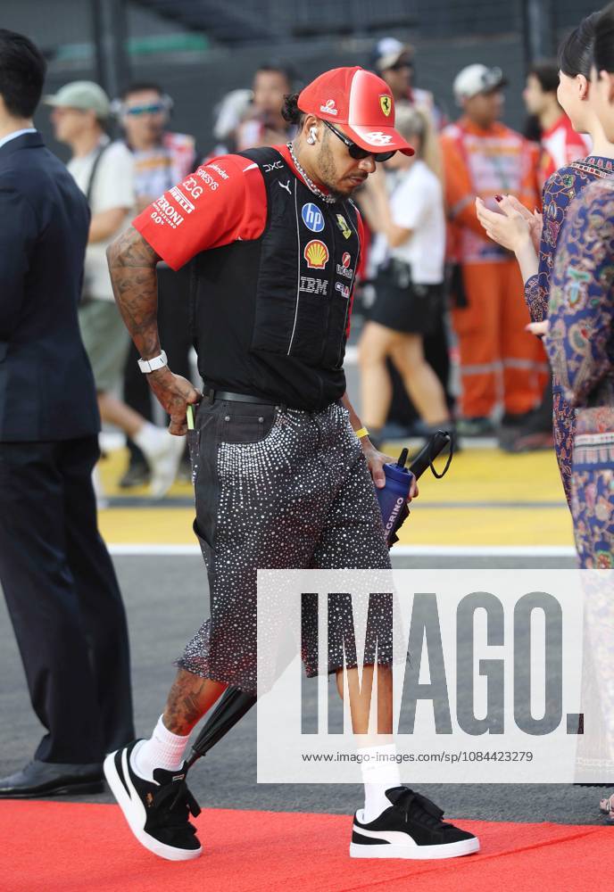 Formula 1 - Singapore Grand Prix SINGAPORE, REPUBLIC OF SINGAPORE, OCTOBER 11: Sir Lewis Hamilton racing driver for Ferrari from Great Britain during FIA Formula 1 Grand Prix of Singapore at Marina Bay Street Circuit, Singapore, Republic of Singapore on October 11. (Photo by Crystal Pix) Singapore Marina Bay Street Circuit Singapore