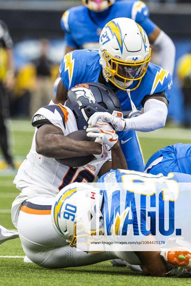 Denver Broncos Wide Receiver Marvin Mims Jr. (19) is brought down by Los Angeles Chargers defensive lineman Nick Barrett (91) and safety RJ Mickens (27) during an NFL, American Football Herren, USA football game, in Inglewood, Calif. on Sunday Oct. 11, 2026. NHL, Eishockey Herren, USA 2026: LA Chargers Vs Denver Broncos - ZUMAc68_ 20261011_zaf_c68_007