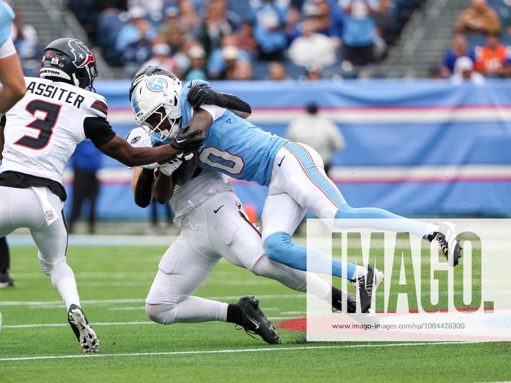 Oct 11, 2026; Nashville, TN, USA; Tennessee Titans wide receiver Calvin Ridley (0) tackled by Houston Texans linebacker Jake Hansen (35) during the NFL, American Football Herren, USA regular season game between the Houston Texans and Tennessee Titans at Nissan Stadium. Mandatory Credit: -Cal Media Nashville USA - ZUMAc04_ 20261011_zma_c04_042