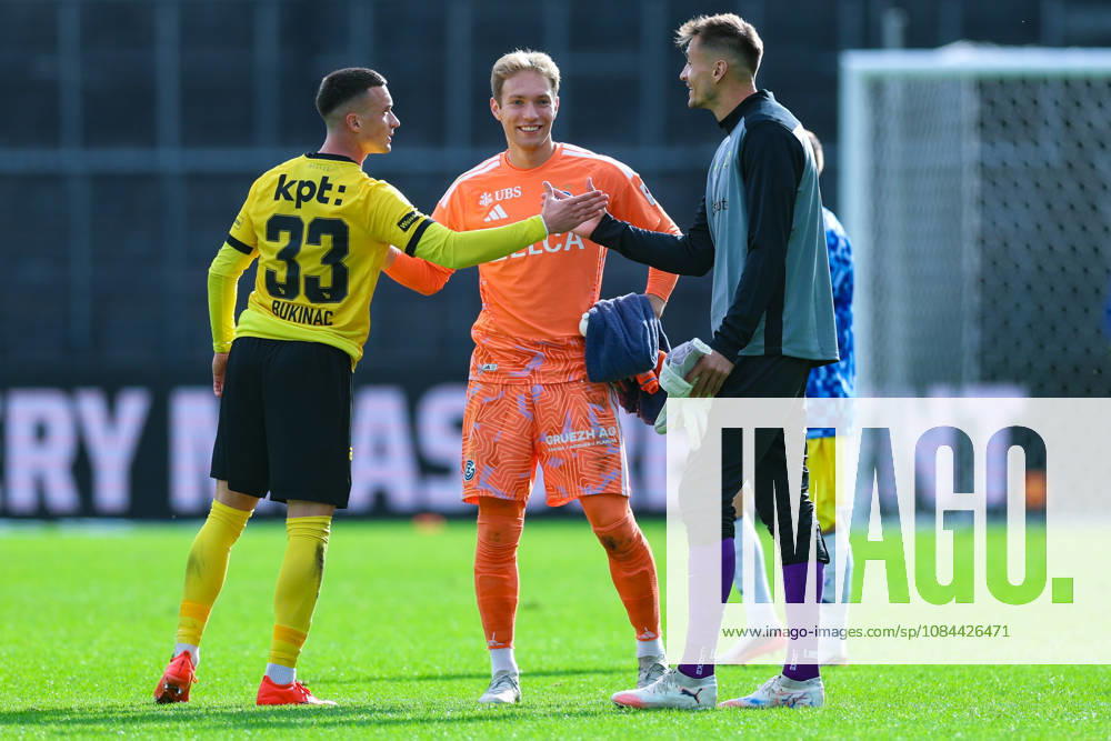 GC Zurich vs. BSC Young Boys, Brack Super League, October 11, 2026: Stefan Bukinac (33), BSC Young Boys (left), Marvin Hübel (1), Grasshopper Club Zurich, and Joël Mall (18), BSC Young Boys in the Brack Super League match between Grasshopper Club Zurich (GCZ) and BSC Young Boys (YB) on October 11, 2026, at Letzigrund Stadium in Zurich, Switzerland; Zurich, Letzigrund Stadium, Zurich, Switzerland
