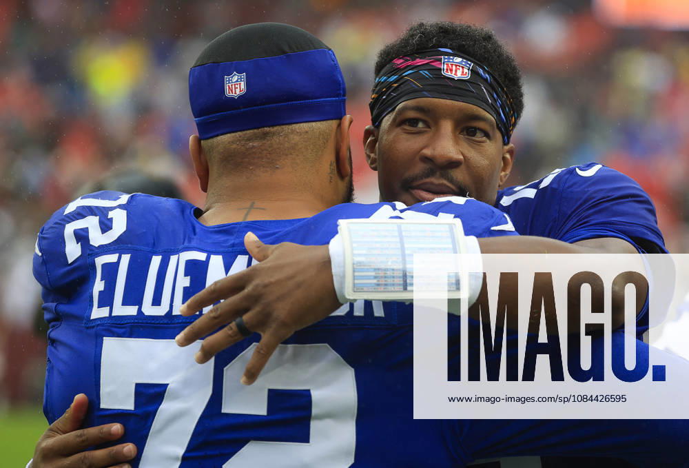 New York Giants QB 19 Jameis Winston hugs New York Giants G 72 Jermaine Eluemunor before the Washington Commanders game against the New York Giants at Northwest Stadium in Landover, MD. CSM Landover United States of America - ZUMAc04_ 20261011_zma_c04_127