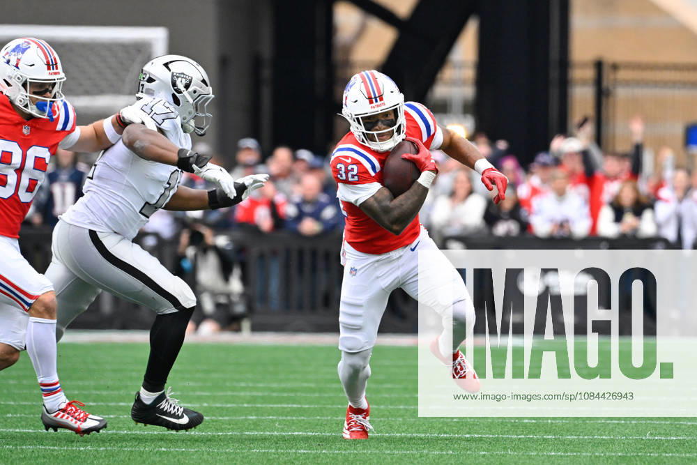 Oct 11, 2026; Foxborough, MA, USA; New England Patriots running back TreVeyon Henderson (32) runs the ball with pressure from Las Vegas Raiders linebacker Nakobe Dean (17) during the first half at Gillette Stadium. Mandatory Credit: -Cal Media Foxborough USA - ZUMAc04_ 20261011_zma_c04_145