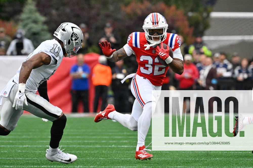Oct 11, 2026; Foxborough, MA, USA; New England Patriots running back TreVeyon Henderson (32) runs the ball against Las Vegas Raiders safety Jeremy Chinn (11) during the first half at Gillette Stadium. Mandatory Credit: -Cal Media Foxborough USA - ZUMAc04_ 20261011_zma_c04_150