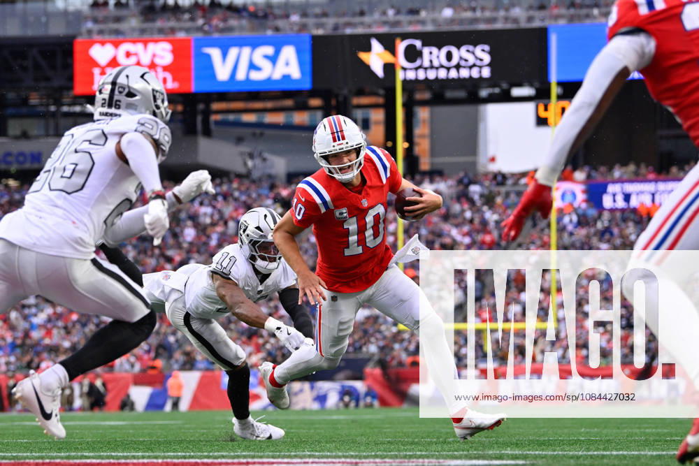 Oct 11, 2026; Foxborough, MA, USA; New England Patriots quarterback Drake Maye (10) avoids a tackle by Las Vegas Raiders safety Jeremy Chinn (11) and runs for a touchdown during the second half at Gillette Stadium. Mandatory Credit: -Cal Media Foxborough USA - ZUMAc04_ 20261011_zma_c04_155