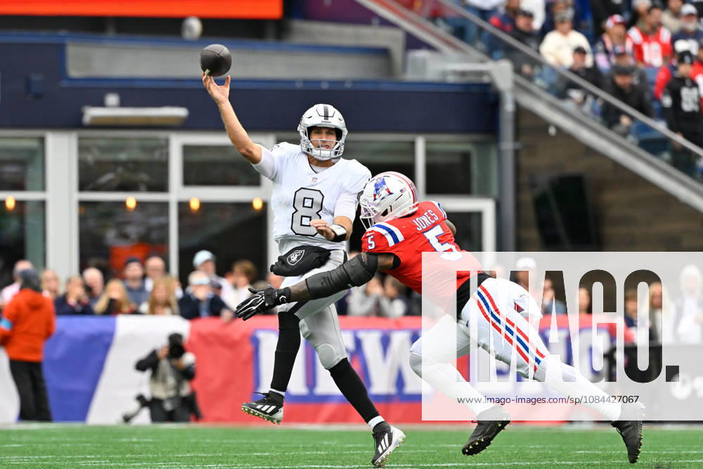 Oct 11, 2026; Foxborough, MA, USA; Las Vegas Raiders quarterback Kirk Cousins (8) throws a pass with pressure fro Las Vegas Raiders cornerback Eric Stokes (5) during the first half at Gillette Stadium. Mandatory Credit: -Cal Media Foxborough USA - ZUMAc04_ 20261011_zma_c04_161
