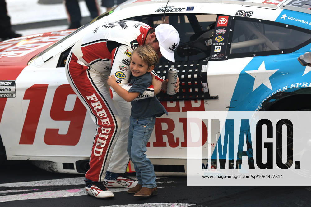 CHARLOTTE, NC - OCTOBER 11: Chase Briscoe ( 19 Joe Gibbs Racing Freebird Spring Water Toyota) celebrates with his son Brooks after winning the NASCAR, Motorsport, USA Cup Series Playoffs Bank of America 400 race on October 11, 2026 at Charlotte Motor Speedway in Charlotte, NC. (Photo by Jeff Robinson Icon Sportswire) AUTO: OCT 11 NASCAR Cup Series Playoffs Bank of America 400 Icon261011856400
