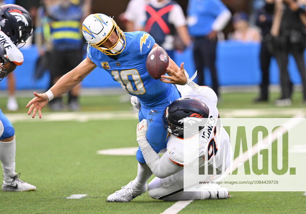 INGLEWOOD, CA - OCTOBER 11: Denver Broncos defensive tackle D.J. Jones (93) tackles Los Angeles Chargers quarterback Justin Herbert (10) while knocking the ball loose during the game between the Los Angeles Chargers and the Denver Broncos on October 11, 2026 at SoFi Stadium in Inglewood. (Photo by David Dennis Icon Sportswire) NFL, American Football Herren, USA OCT 11 Broncos at Chargers Icon26101147
