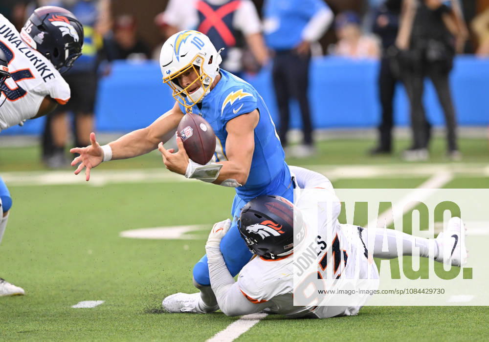 INGLEWOOD, CA - OCTOBER 11: Denver Broncos defensive tackle D.J. Jones (93) tackles Los Angeles Chargers quarterback Justin Herbert (10) while knocking the ball loose during the game between the Los Angeles Chargers and the Denver Broncos on October 11, 2026 at SoFi Stadium in Inglewood. (Photo by David Dennis Icon Sportswire) NFL, American Football Herren, USA OCT 11 Broncos at Chargers Icon26101148