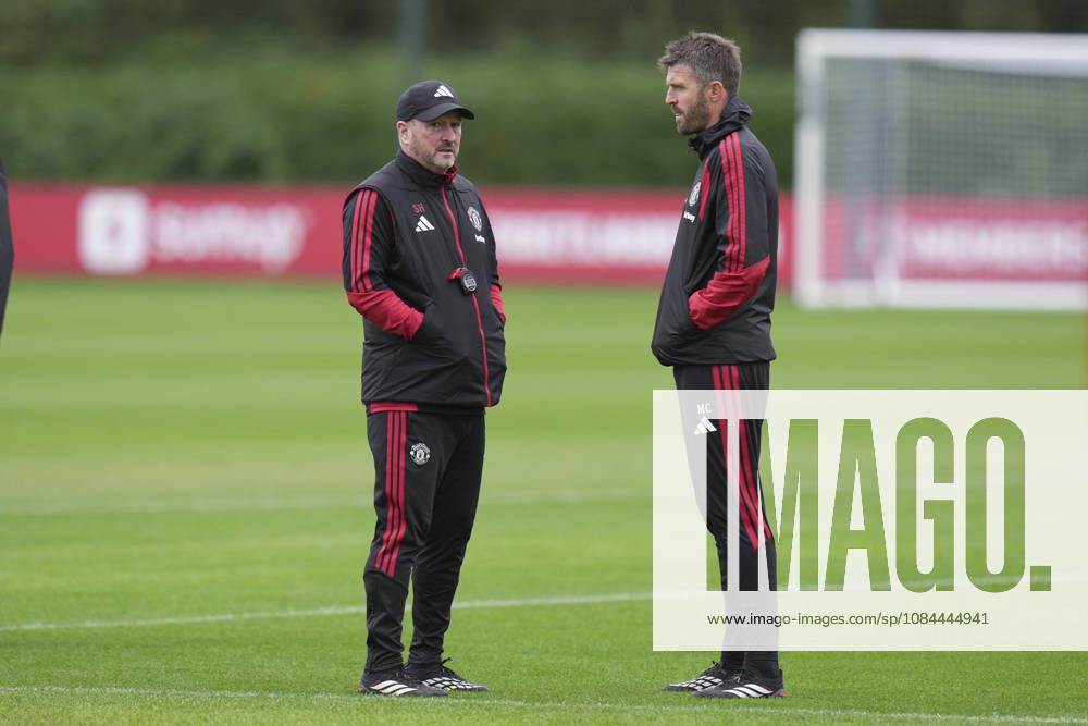 Manchester United, ManU Training, Champions League Manchester United assistant manager Steve Holland speaks with Manchester United manager Michael Carrick during the Manchester United Training Session at Carrington Training Centre, ahead of the UEFA Champions League Matchday 2 v Atletico Madrid, Manchester, England on 12 October 2026 Credit: Steve Flynn Every Second Media Editorial use only. All images are copyright Every Second Media Limited. No images may be reproduced without prior permission.