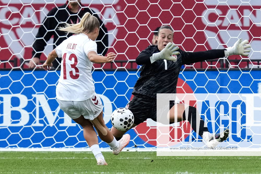 Denmark s Olivia Holdt places the ball past Canada goalkeeper Kailen Sheridan to score her country s third goal during first half International Friendly, Länderspiel, Nationalmannschaft action, in Toronto, on Monday Oct. 12, 2026. Canada News - October 12, 2026 - ZUMAc35_ 20261012_zaf_c35_057