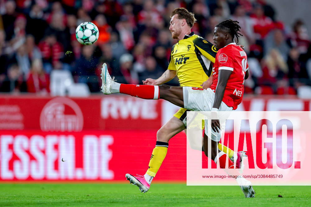 Soccer, 3rd Division, Rot Weiss Essen vs. SC Fortuna Köln, Hafenstraße Stadium, Matchday 9, 2026–27 Season: Franci Bouebari (RWE 19) in a tackle against Jannik Mause (SC Fortuna Köln 37). DFB regulations prohibit any use of photographs as image sequences and or quasi-video. North Rhine-Westphalia, Germany