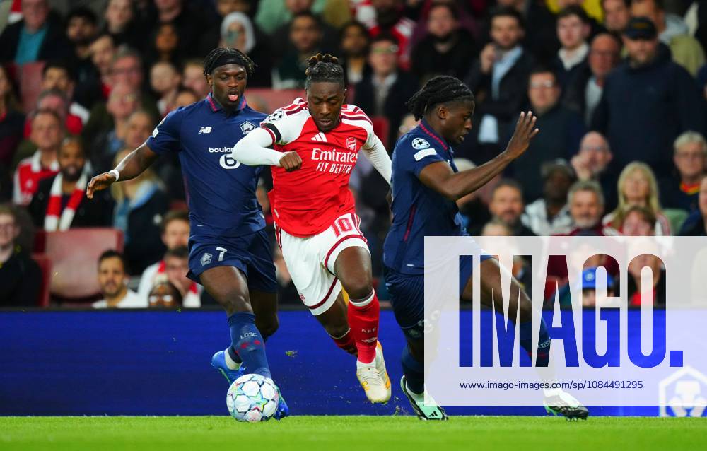 Eberechi Eze of Arsenal finds a gap b etween Dilane Bakwa and Maxima Goffi of Lille Arsenal v Lille, UEFA Champions League, Football, Emirates Stadium, London, UK - 13 Oct 2026London Emirates Stadium United Kingdom