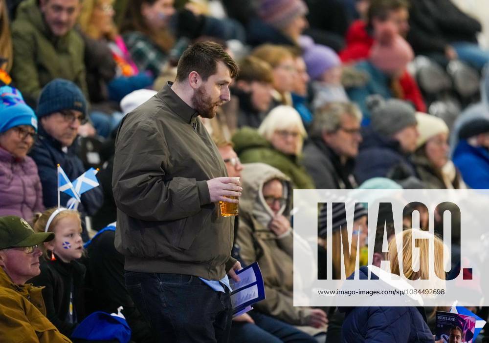 A fan carries a pint of lager in the stand. Alcohol is on sale at tonight s Scotland Women v Czechia match at The Marbill Coaches Stadium, Paisley, as a controlled trial between the Scottish football authorities and the Scottish Government. Scotland Women v Czechia, Women s European World Cup Qualifier, Football, The Marbill Coaches Stadium, Paisley, Scotland, UK - 13 Oct 2026Paisley The Marbill Coaches Stadium Scotland United Kingdom