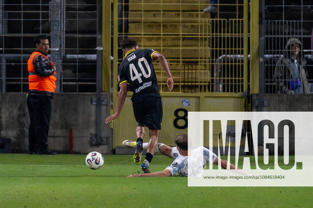 Battle for the Ball: Tackle between Michael Eberwein (TSV 1860 Munich, 13) and Micah Ham (SpVgg Bayreuth, 40) GER, TSV 1860 Munich vs. SpVgg Oberfranken Bayreuth, soccer, Bavarian Regional League, Matchday 14, 2026–2027 season, October 13, 2026 DFL and DFB regulations prohibit any use of photographs as image sequences and or quasi-video. Photo: HMB Media, Heike Feiner