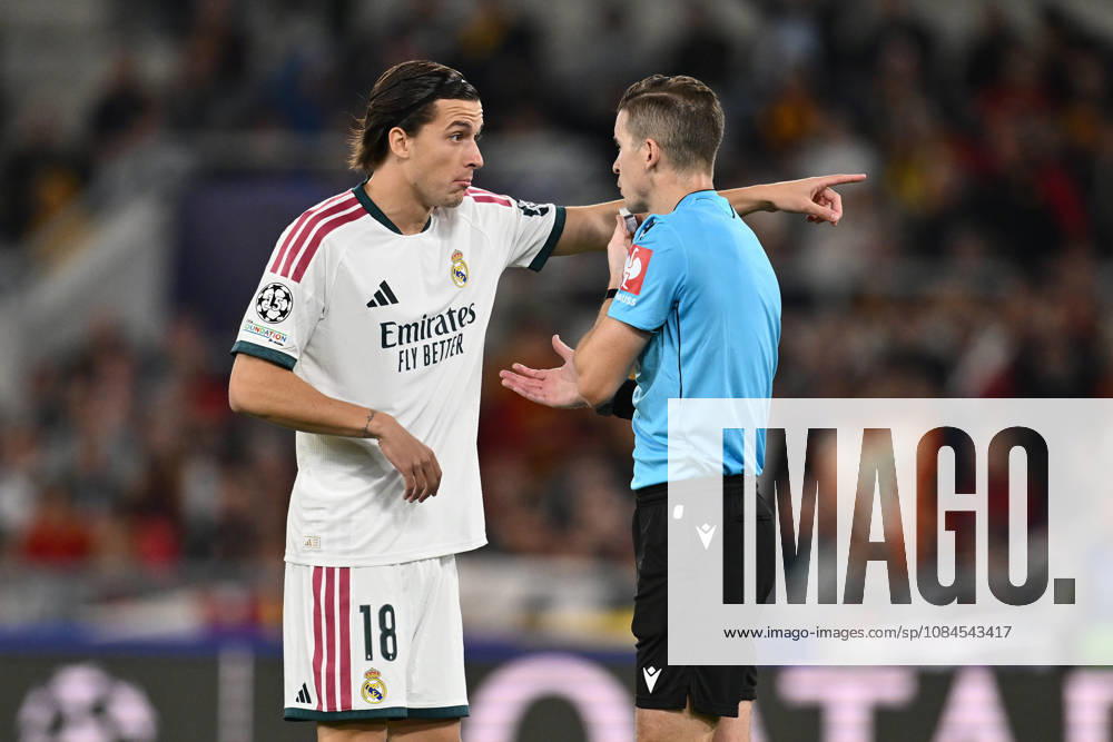 IPA89697109 - Alvaro Carreras of Real Madrid C.F. and Referee Francois Letexier (FRA) take part in the UEFA Champions League Matchday 2 soccer match between A.S. Roma and Real Madrid C.F. at the Olympic Stadium on October 14, 2026, in Rome, Italy.