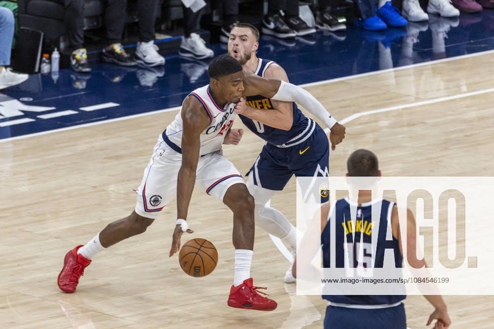 Los Angeles Clippers Rui Hachimura (28) drives against Denver Nuggets Christian Braun (0) during an NBA, Basketball Herren, USA preseason game at Intuit Dome on Wednesday, Oct. 14, 2026 in Inglewood Calf. NBA 2026: Clippers Vs Nuggets - ZUMAc68_ 20261014_zaf_c68_012