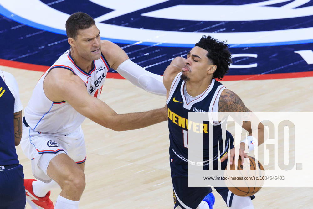 Julian Strawther 1 of the Denver Nuggets drives past Brook Lopez 11 of the Los Angeles Clippers during their preseason NBA, Basketball Herren, USA game on Wednesday October 14, 2026 at Intuit Dome in Inglewood, California. ARIANA RUIZ PI Clippers Vs. Nuggets - Preseason - ZUMAp124 20261014_zaa_p124_030