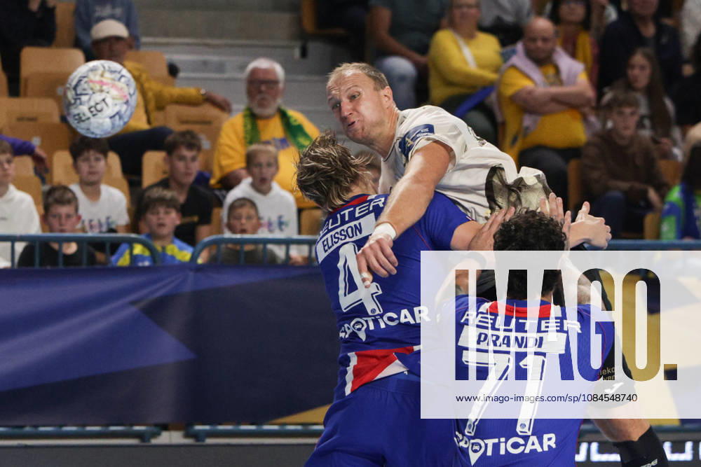 (261015) -- CELJE, Oct. 15, 2026 -- Ziga Mlakar (top C) of RK Celje Pivovarna Lasko shoots the ball during the European Handball Federation (EHF) Champions League match between RK Celje Pivovarna Lasko and Paris Saint-Germain at Zlatorog Sports Hall in Celje, Slovenia, Oct.14, 2026. (Photo by Xinhua) (SP)SLOVENIA-CELJE-HANDBALL-EHF CHAMPIONS LEAGUE-RK CELJE PIVOVARNA LASKO VS PARIS SAINT-GERMAIN ZeljkoxStevanic