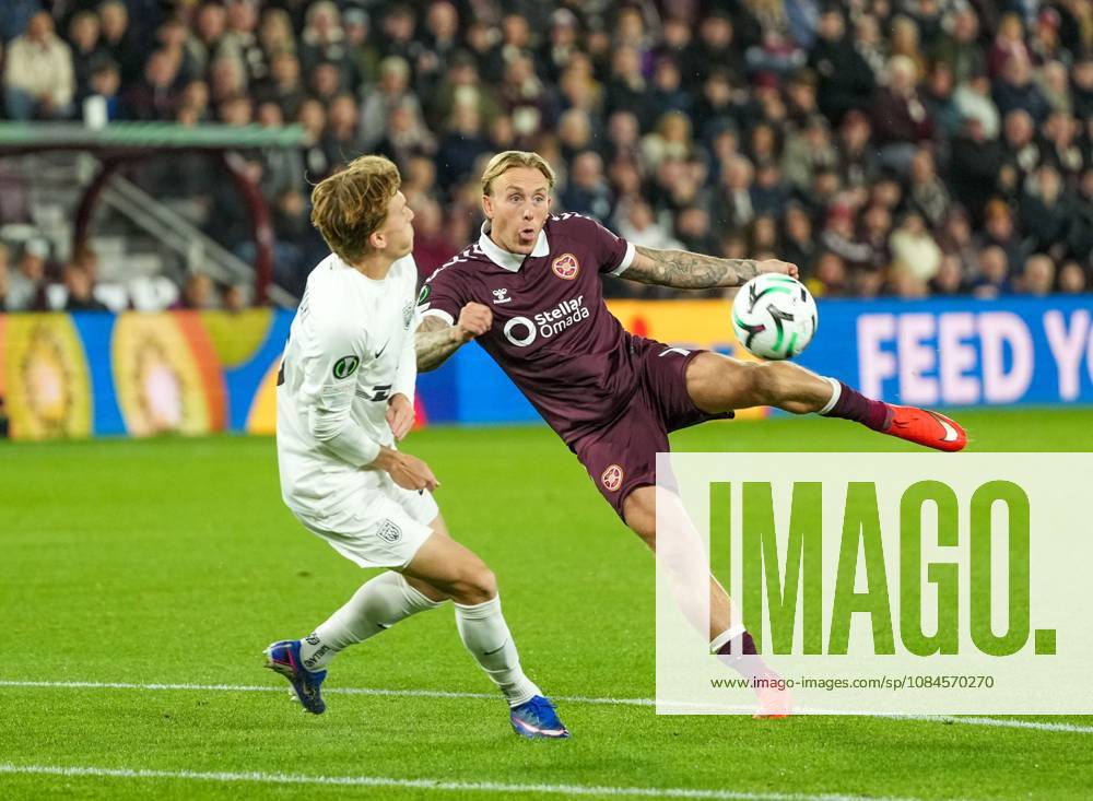 Calvin Miller of Heart of Midlothian shoots at goal under pressure from Juho Lahteenmaki of FC Nordsjaelland Heart of Midlothian v Nordsjaelland, UEFA Conference League, Football, League Phase, Matchday 1, Tynecastle Park, Edinburgh, Scotland, UK - 15 Oct 2026Edinburgh Tynecastle Park Scotland United Kingdom