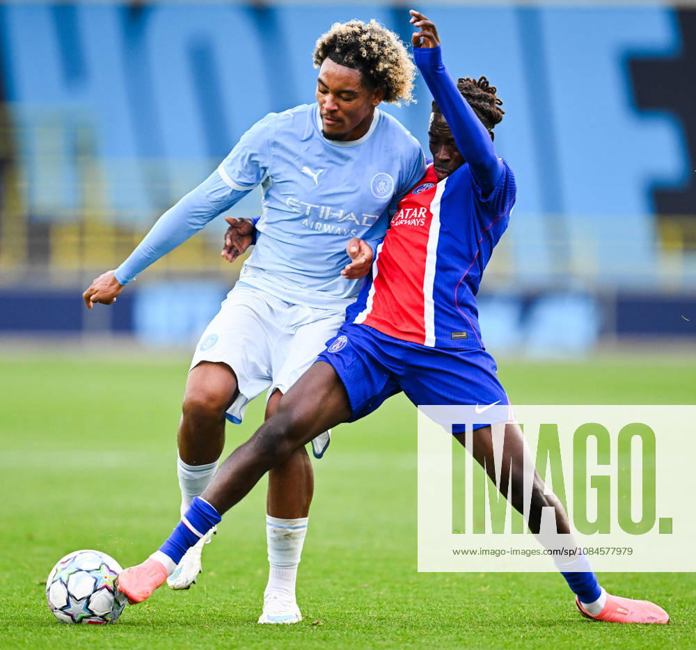 Floyd Samba of Manchester City is tackled by Vainqueur Nzinga of Paris Saint Germain during the UEFA Youth League football match between Manchester City and Paris Saint Germain at the Etihad Stadium in Manchester, England. (Photo by Will Palmer Sports Press Photo)
