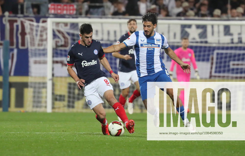 Guillermo Balzi, Holstein Kiel; Kevin Sessa, Hertha BSC Berlin; Soccer, Men s, 2026–2027 Season, 2. Bundesliga, Holstein Stadium, Holstein Kiel vs. Hertha BSC Berlin. DFL regulations prohibit any use of photographs as image sequences and or quasi-video.