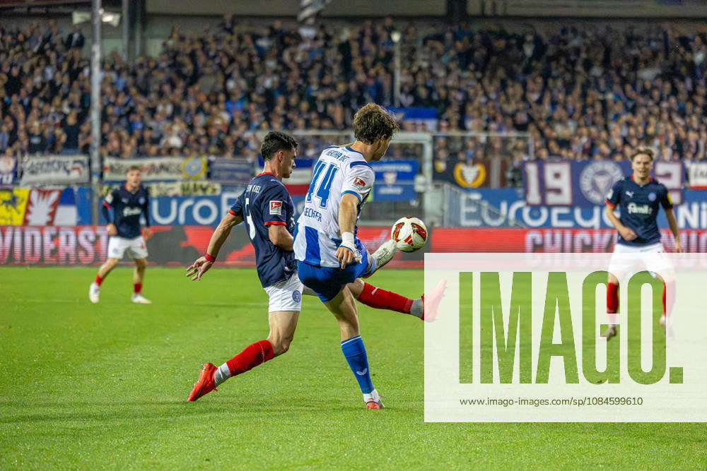 Soccer 2. Bundesliga Men s 2026–2027 Season, Matchday 8: Holstein Kiel vs. Hertha BSC (Kiel in dark blue), Berlin in white and blue stripes; Guillermo Balzi (left), Linus Gechter; Holstein Kiel Stadium, Westring 501, Schleswig-Holstein, Germany